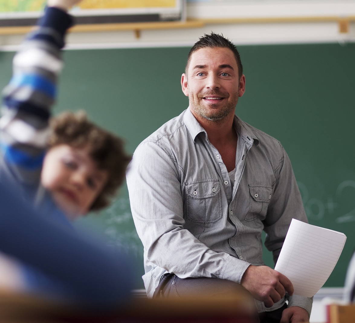 Male teacher engaging with students