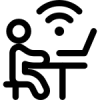 Icon of person sitting at a desk on a laptop using internet